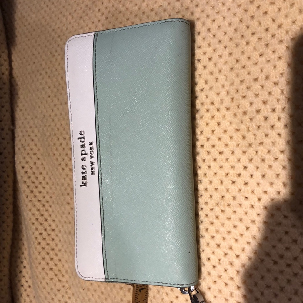 Lightly used Kate Spade mint and white accordion style wallet